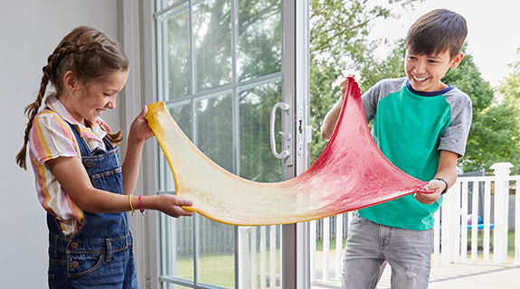ecomm-SAP-elmers-color-changing-slime-2pc-with-uv-light-house-entrance-lifestyle-with-talent-1-66639-0