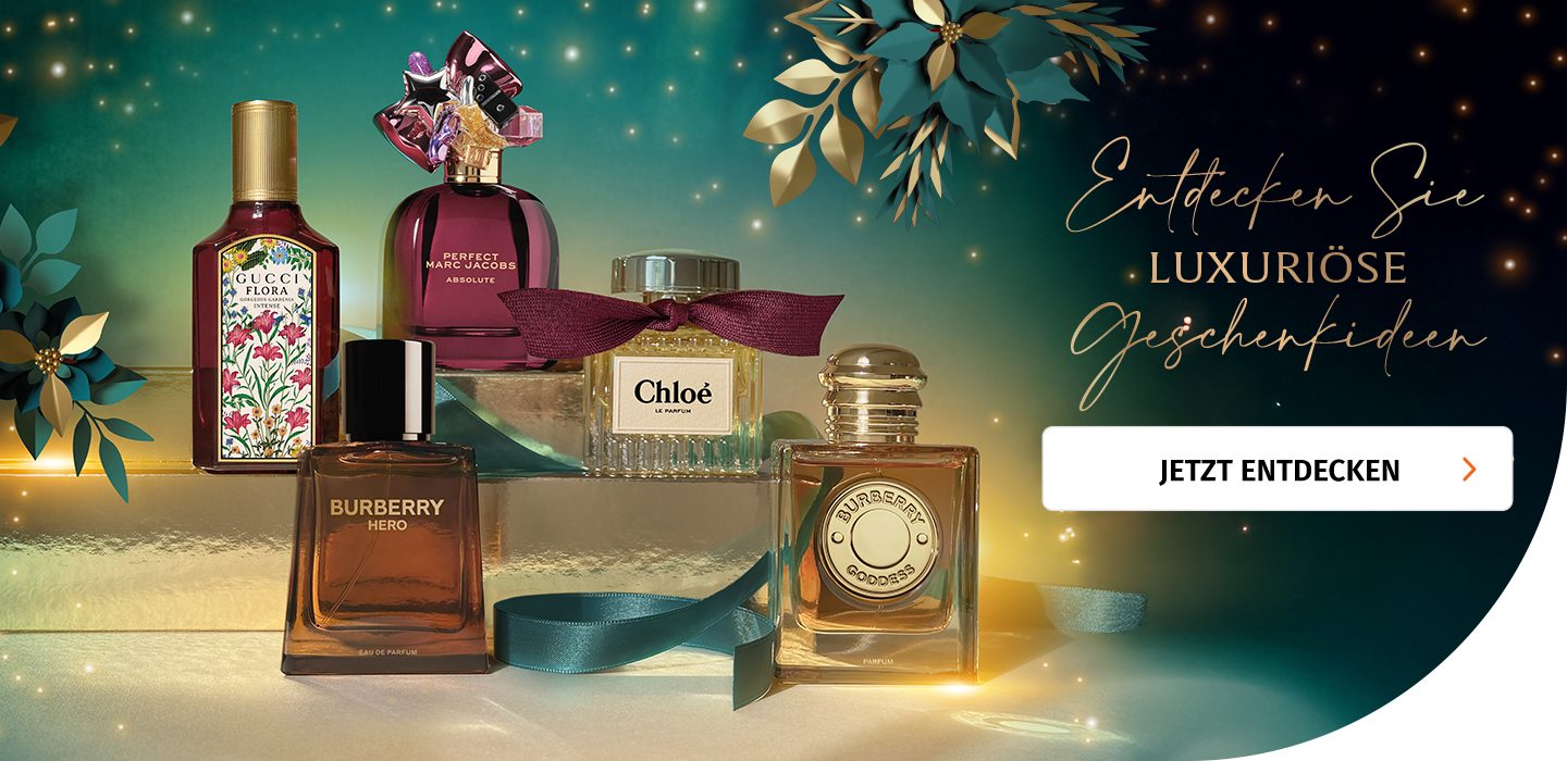 Parfums von Gucci, Marc Jacobs, Burberry und Chloé vor Weihnachtshintergrund