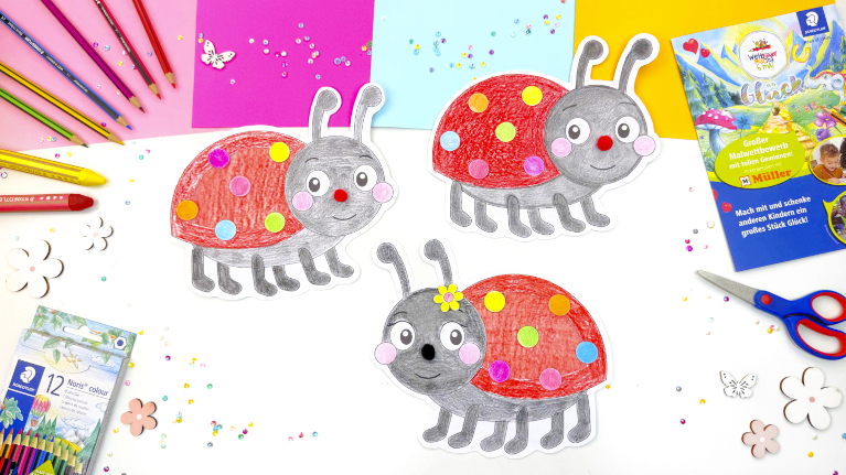 Ausgeschnittene Marienkäfer mit bunten Punkten