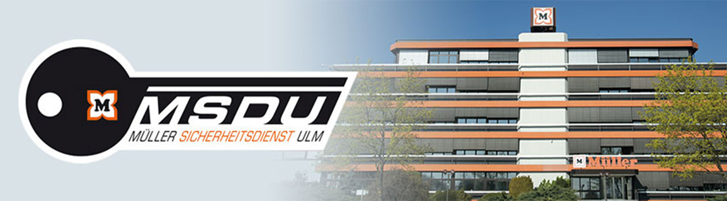 MSDU‑Logo neben Müller‑Firmengebäude mit orange‑grauen Fassadenstreifen
